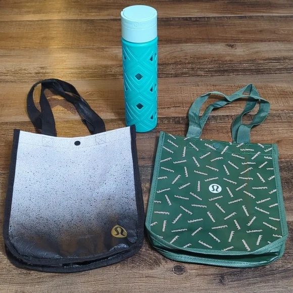 Lululemon - 2 Small Reusable Tote Gift Bags and Glass Water Bottle With Silicone - Picture 1 of 15